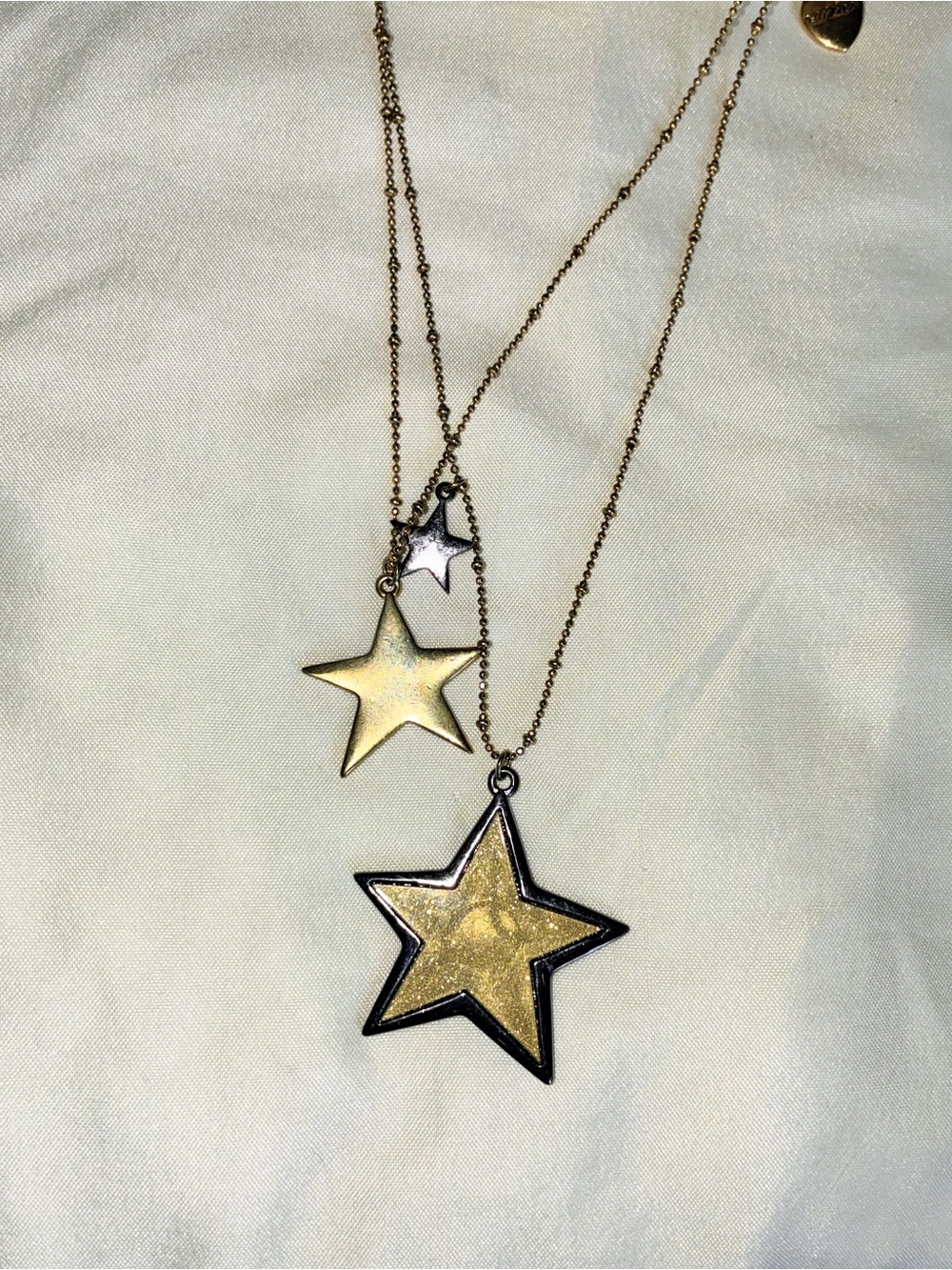 Betsey Johnson silver tone and gold tone star necklace with three star pendants